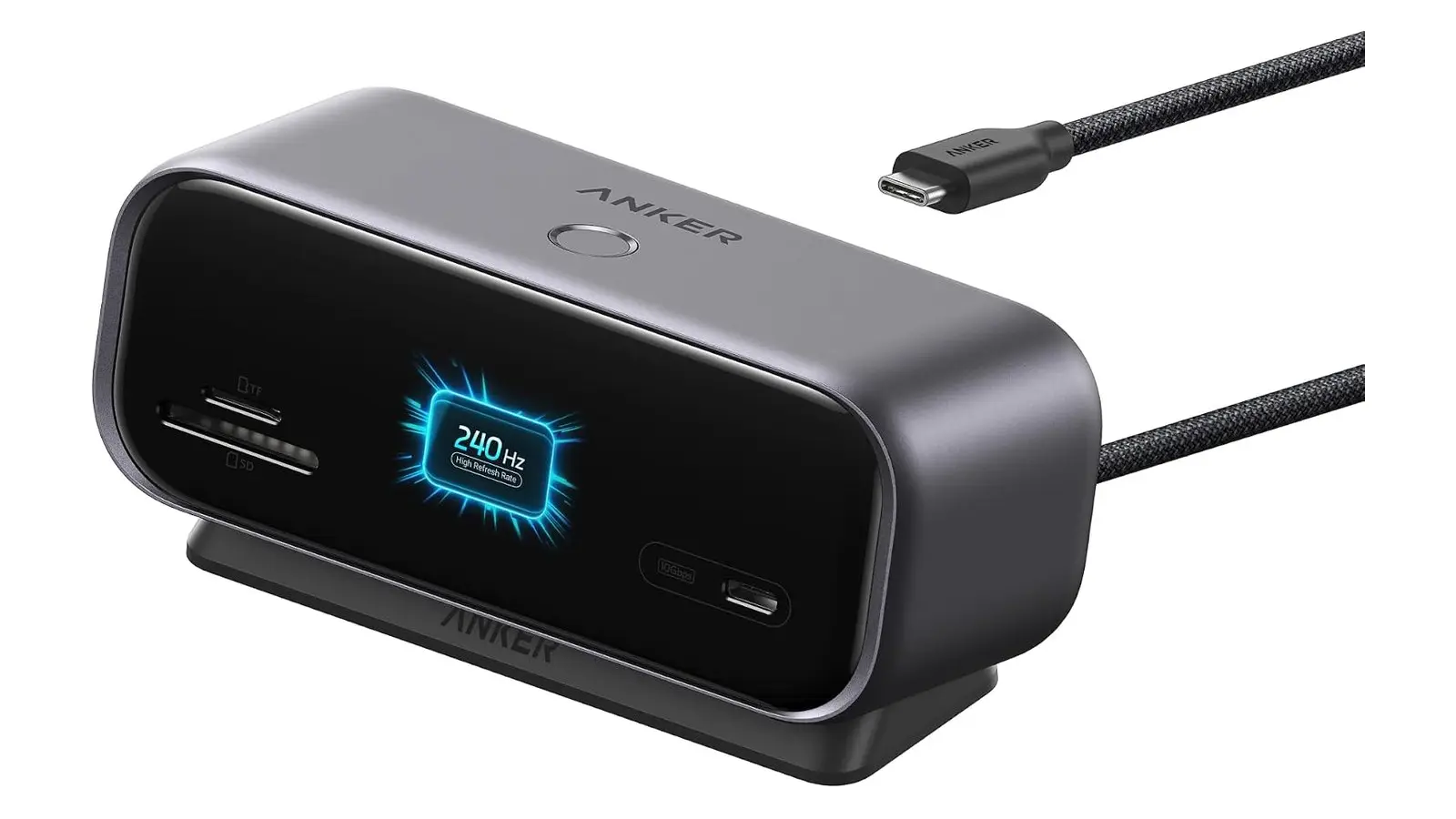 A grey Anker desktop dock with a black glass front, a small screen reading 240 Hz, SD and microSD slots and a USB-C port, and a braided cable with a USB-C plug.