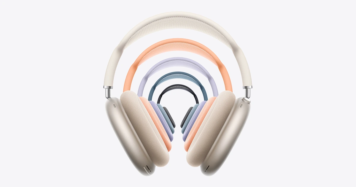 Apple AirPods Max 2 over-ear headphones in five colours, Starlight, Orange, Purple, Blue and Midnight, shown in a row on a light background.