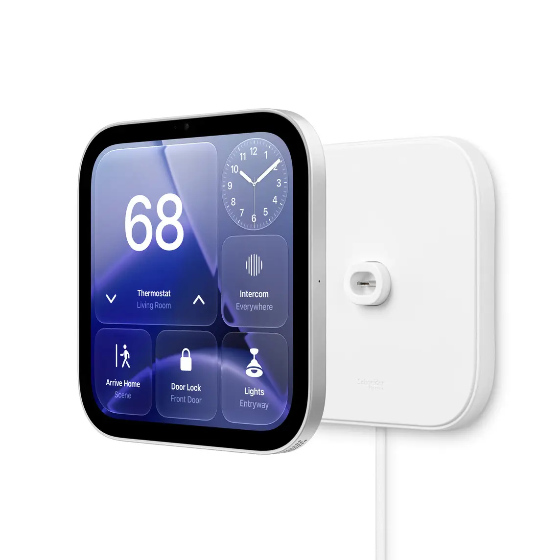 A wall-mounted Apple HomeView beside its white square Schneider Home USB-C Wall Connector mount, with a white braided cable running down from the mount.