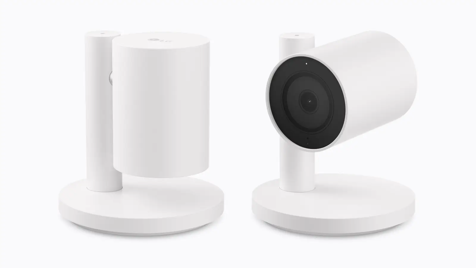 Two white LG indoor cameras on round bases, one with its head turned down and one tilted up to show the lens.