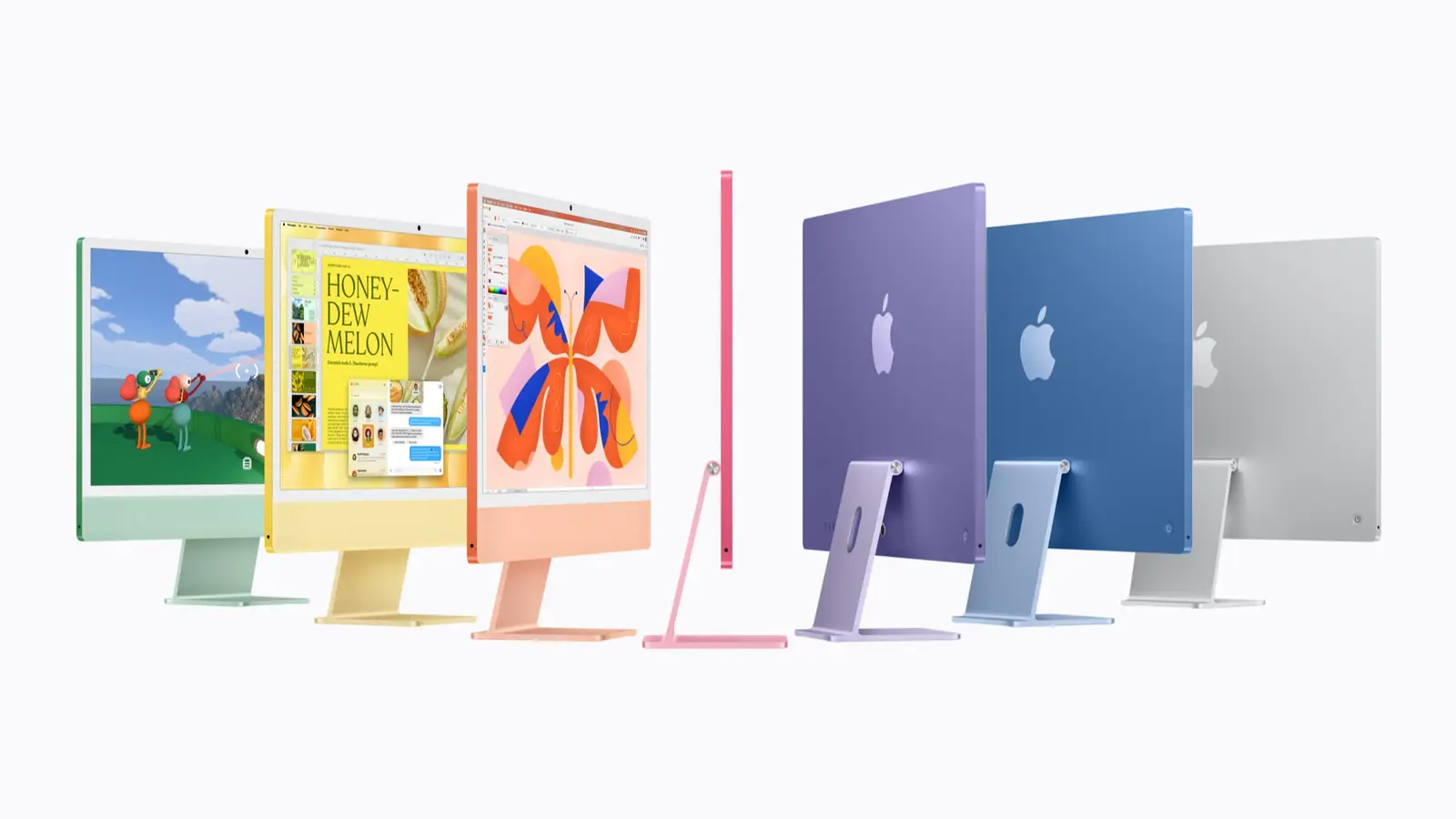 Seven iMac desktops in green, yellow, orange, pink, purple, blue and silver.
