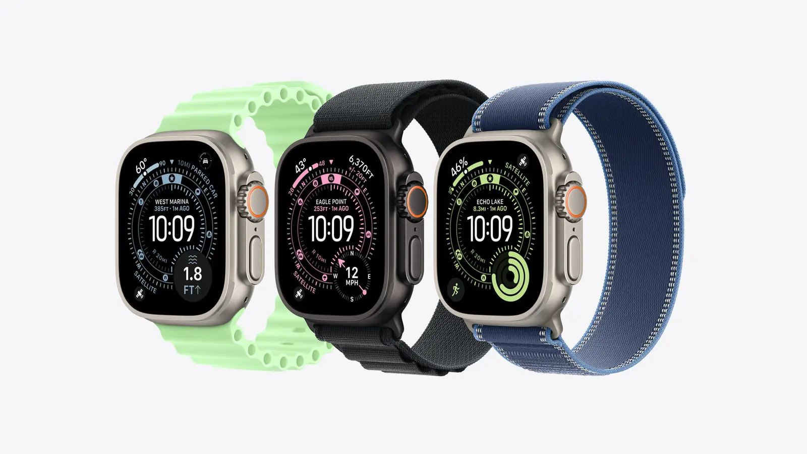 Three Apple Watch Ultra 3 watches side by side: natural titanium with a green Ocean Band, black titanium with a black Alpine Loop, and natural titanium with a blue Trail Loop.