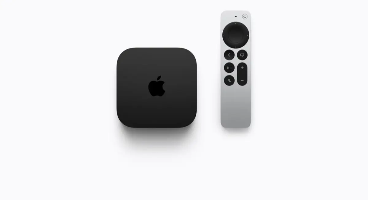 The new Apple TV 4K black box standing next to its silver Siri Remote on a plain light background.