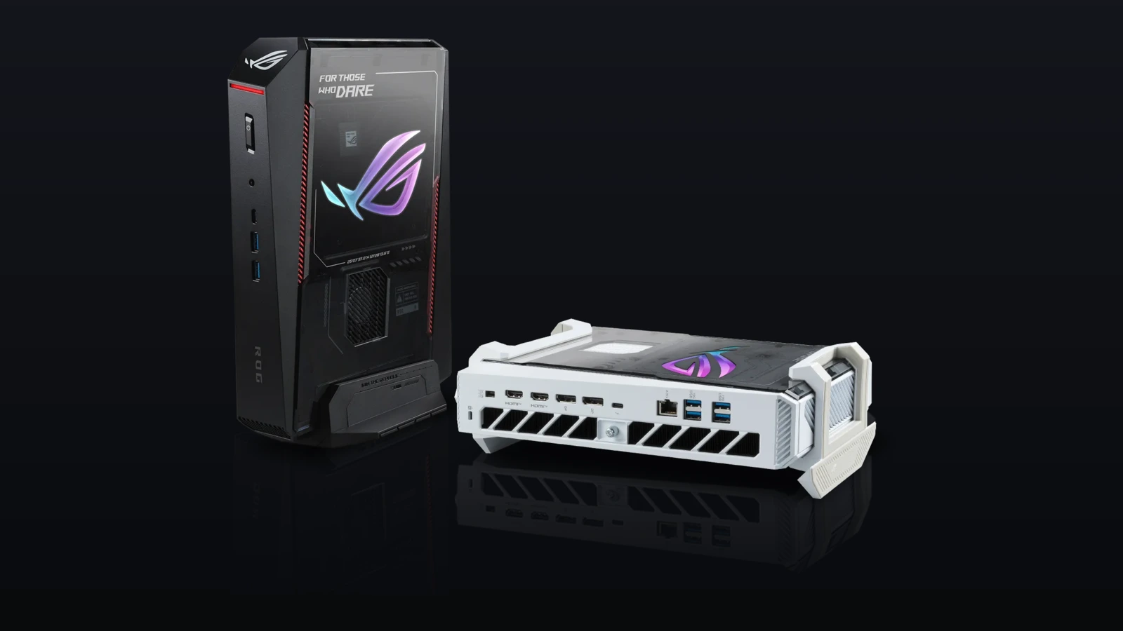 A black ROG NUC 16 mini PC standing upright beside a white one lying flat, showing the rear ports, on a dark background.