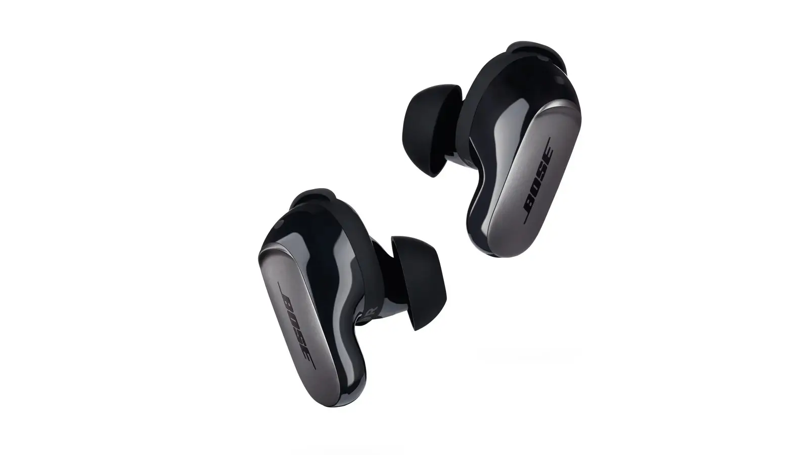 A pair of black Bose QuietComfort Ultra Earbuds floating at an angle on a white background, each with a small BOSE logo on its side.