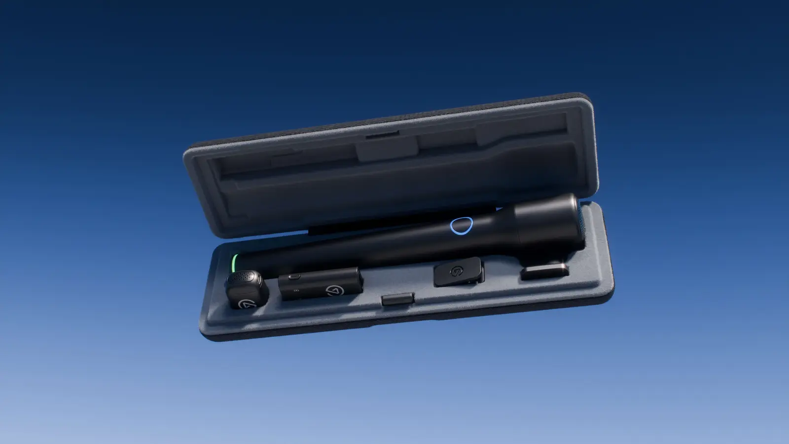 The Elgato Wave Go kit in its open carrying case on a blue gradient background, with the black Smart Handle, the round transmitter, the receiver, a clip and a plate in the case slots.