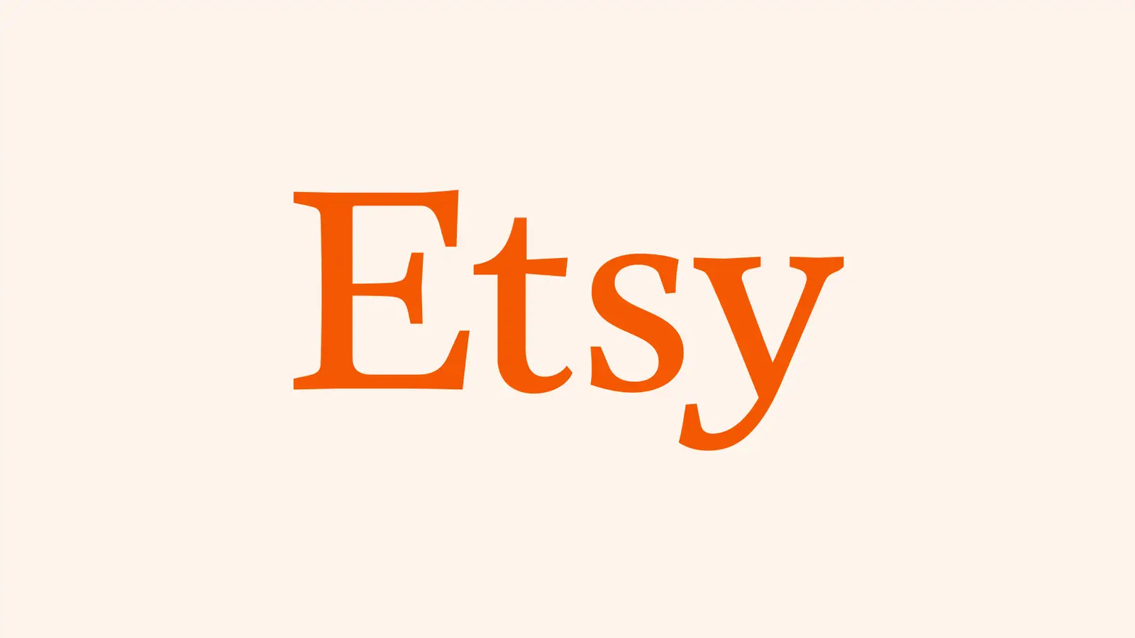The orange Etsy wordmark centered on a pale peach background.