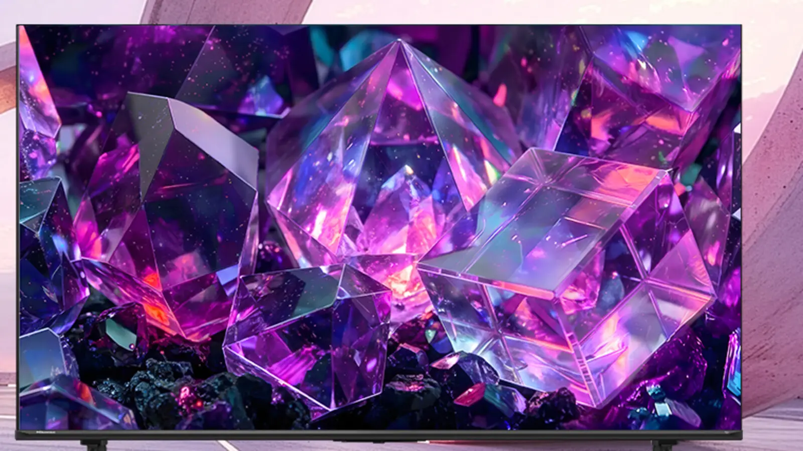 A large Hisense E7 Series TV with its screen filled with glowing purple and pink crystals against a pale lilac backdrop.