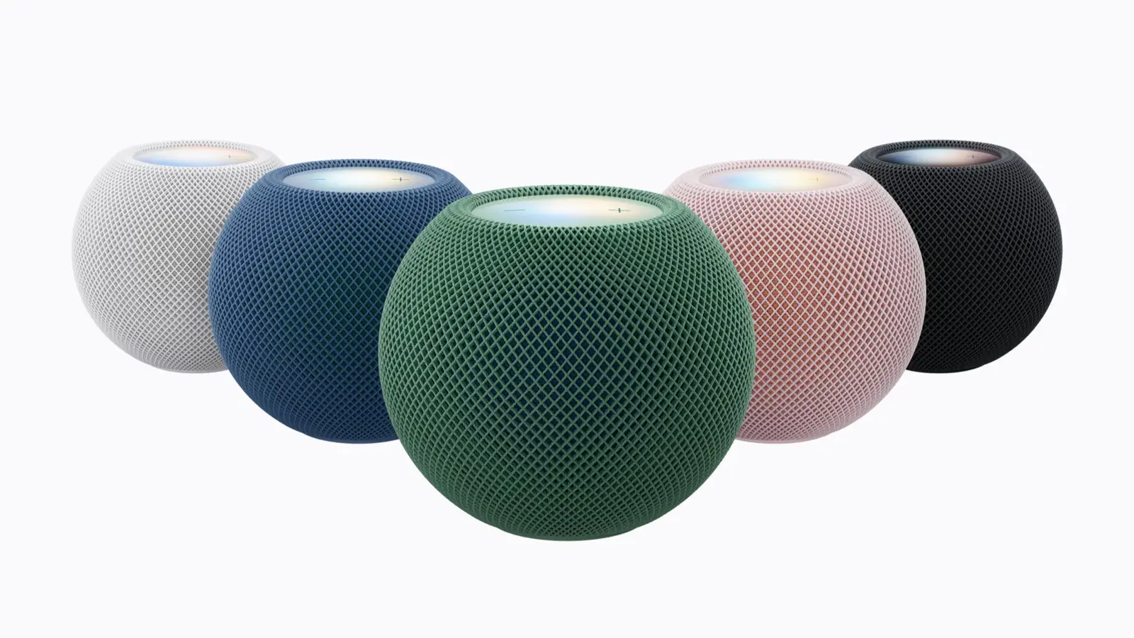 Five HomePod mini 2 speakers in white, blue, green, pink and midnight on a plain light background.