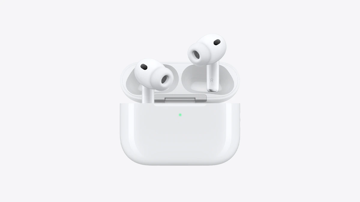 An AirPods Pro charging case, lid open with both earbuds raised, and a green status light on the front of the case, on a light grey background.