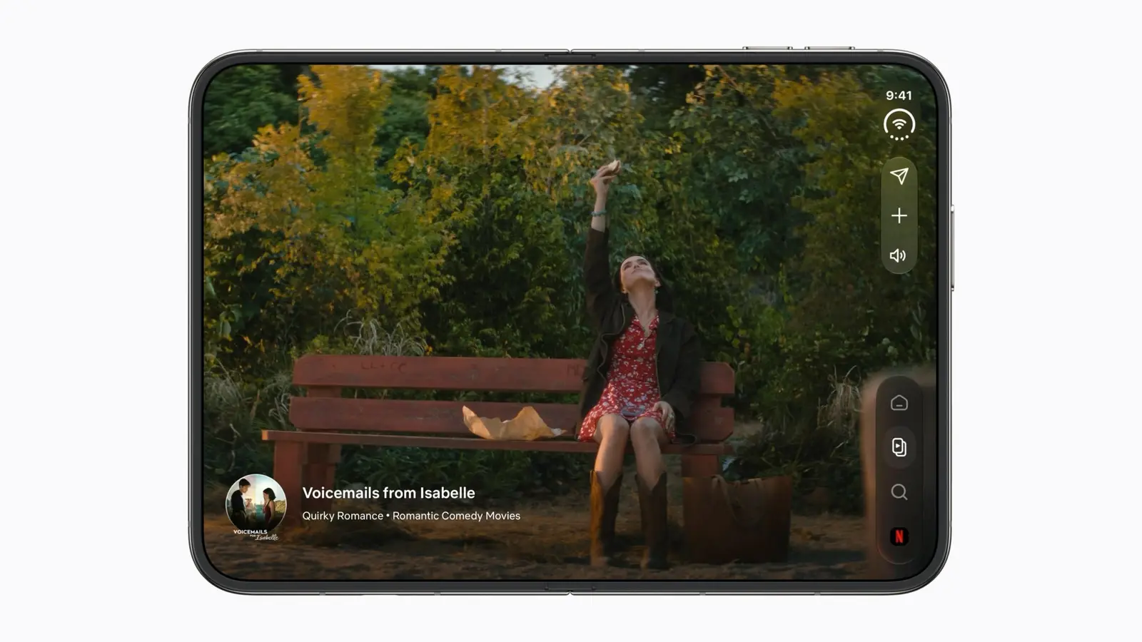 An iPhone Duo opened flat and held in landscape, with a film scene playing across its full inner display.