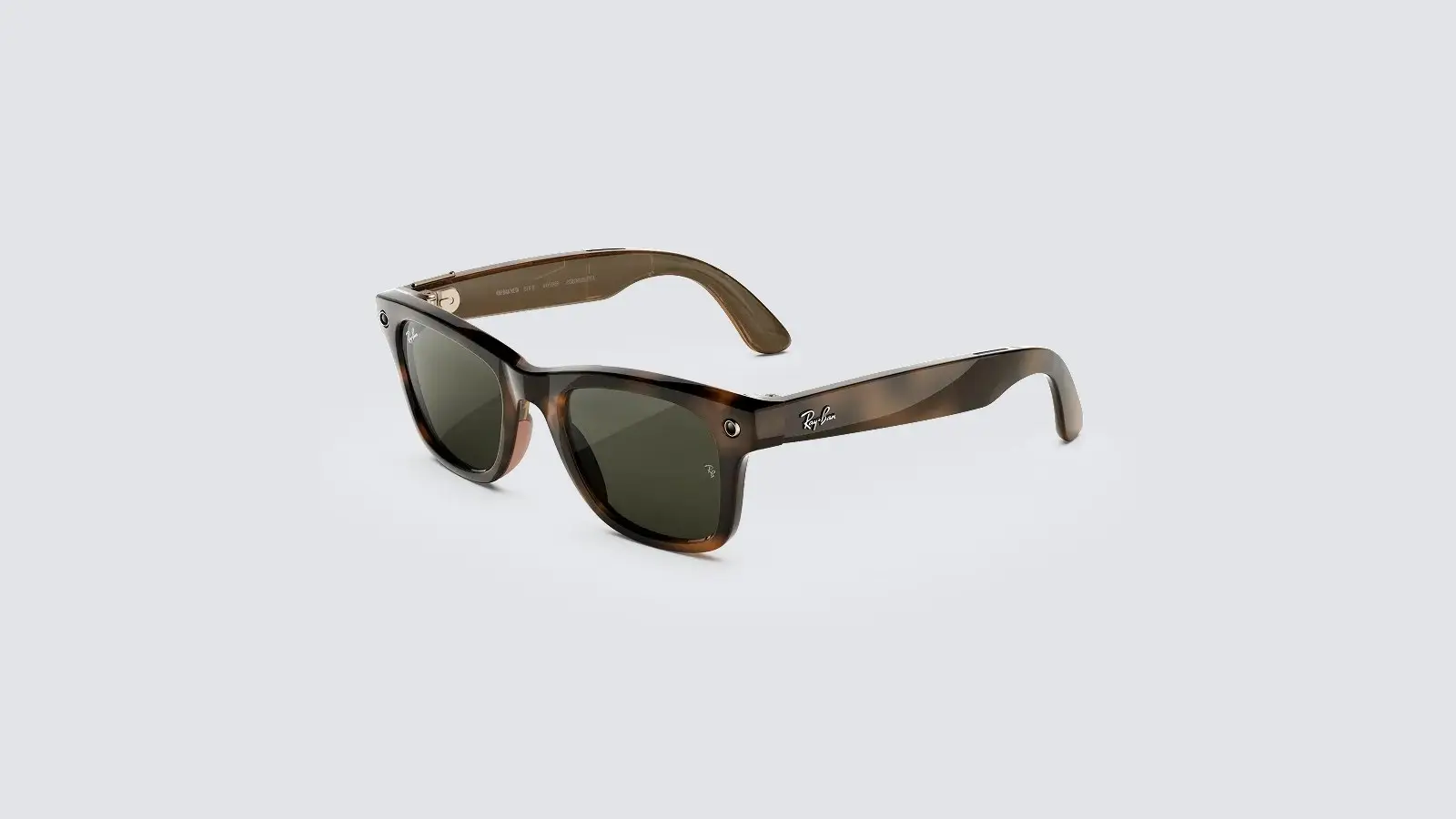 A pair of Ray-Ban Meta Wayfarer glasses with Havana tortoiseshell frames and green lenses, shown at an angle on a light grey background.