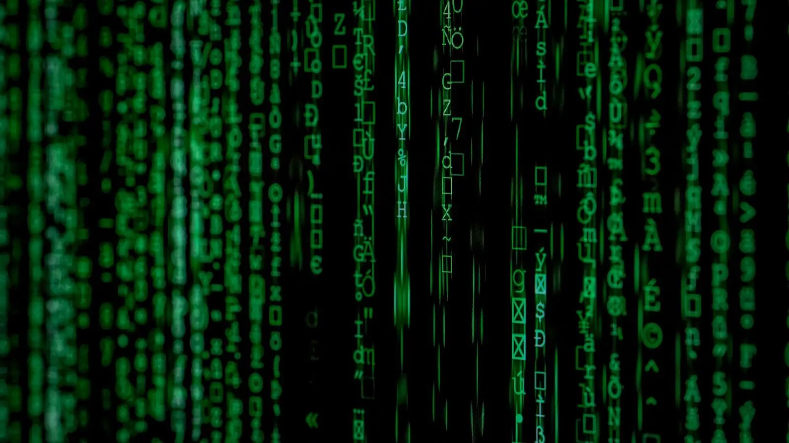 Green characters cascading down a dark screen