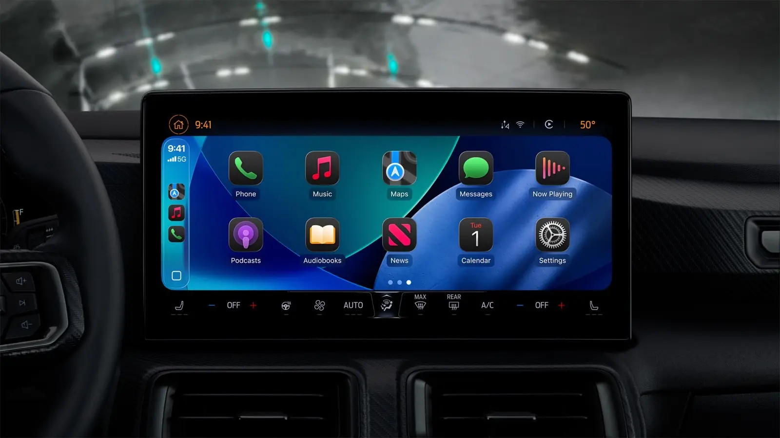 A CarPlay home screen in dark mode on a car's dashboard display, with Phone, Music, Maps and other apps above the air vents.