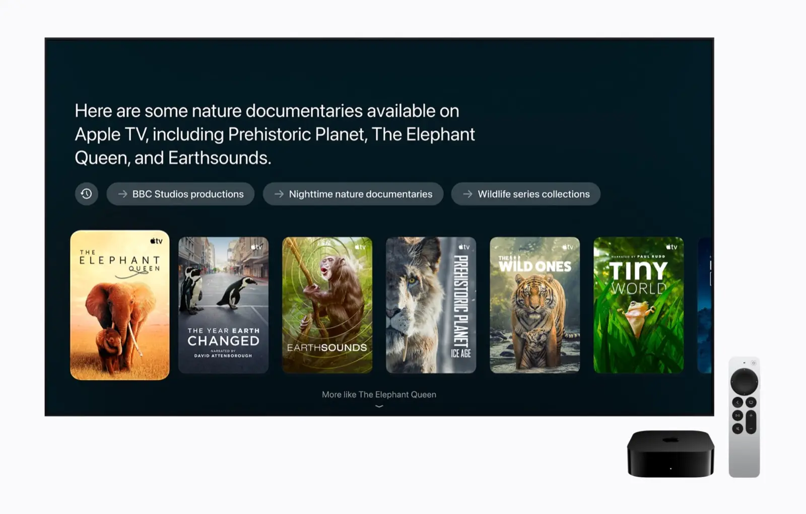 A TV showing Siri-suggested nature documentaries, with the black Apple TV 4K box and the silver Siri Remote below it.