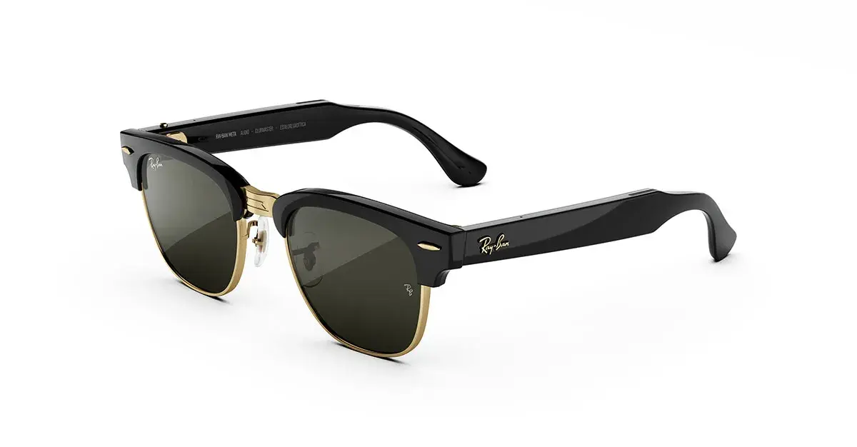 Ray-Ban Meta Audio Clubmaster glasses in shiny black with gold rims and green lenses, seen from the side at an angle.