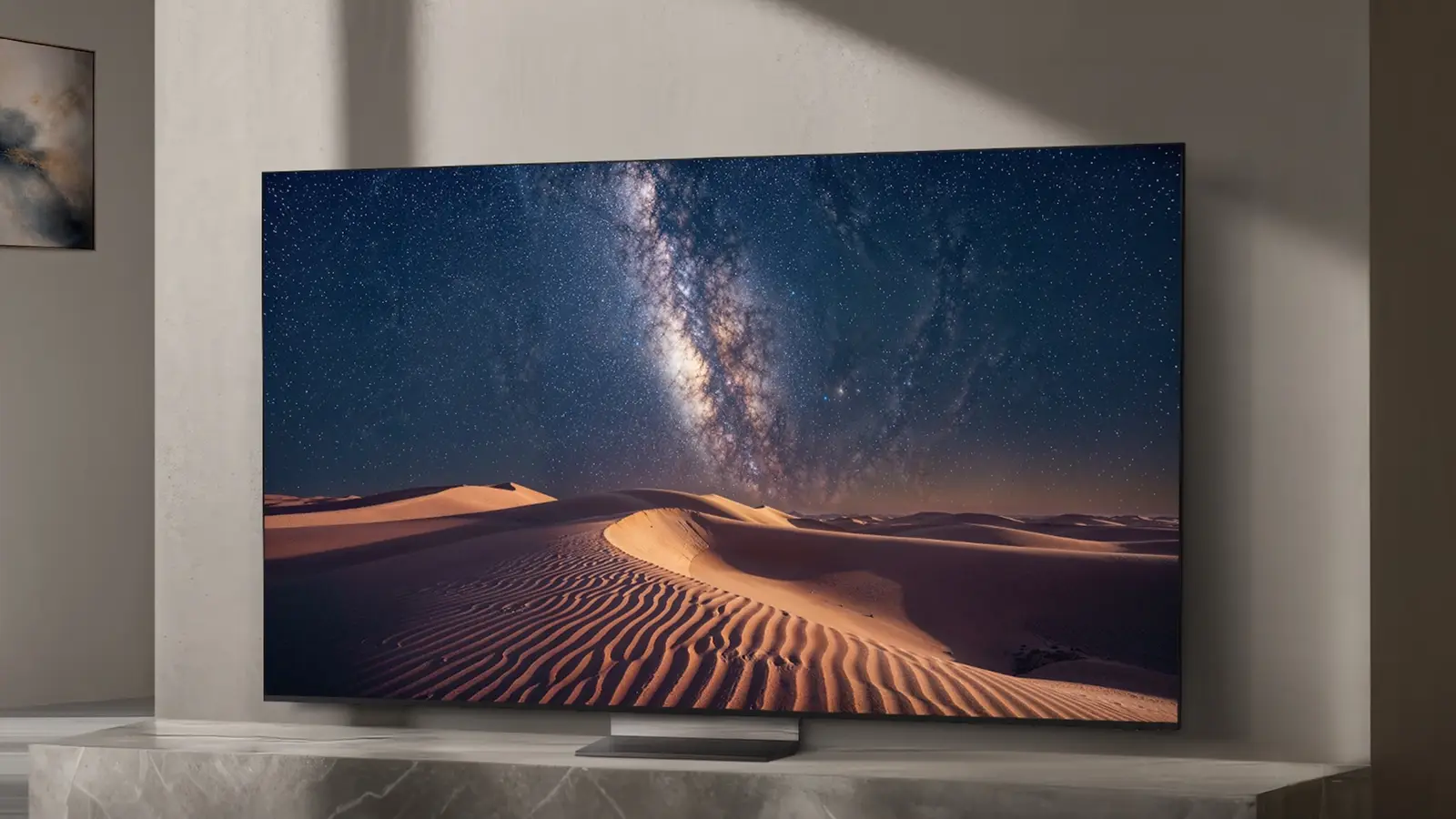 Samsung marketing image of a Micro RGB TV on a stone stand in a sunlit room, its screen showing a starry sky over desert dunes.