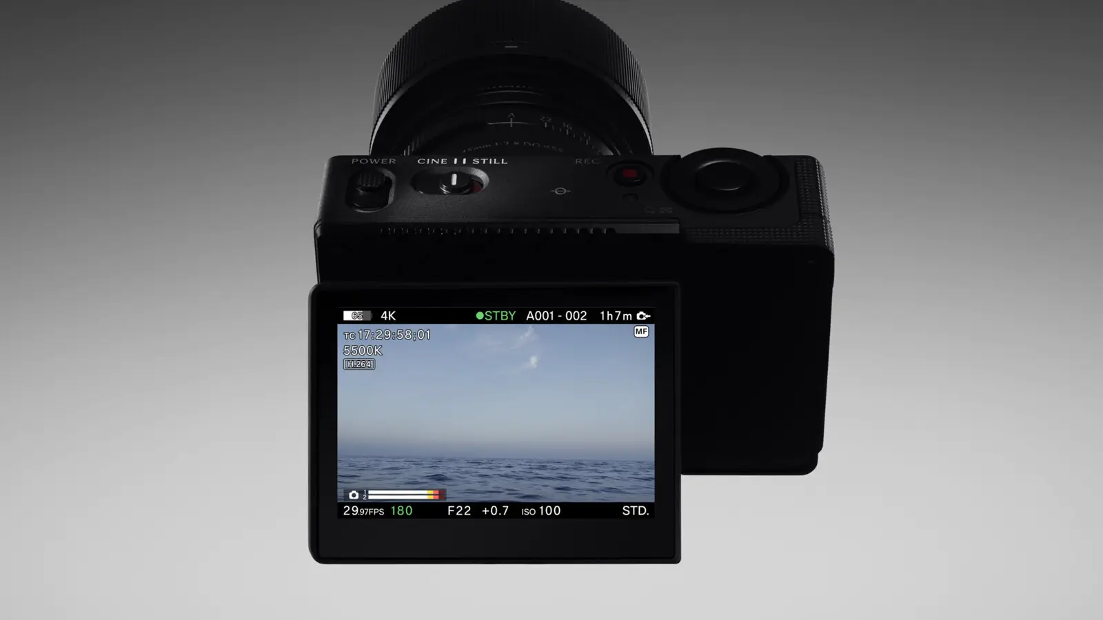 The Sigma FP2 from behind with its screen tilted down, showing the Cine and Still switch on top and a 4K recording display.